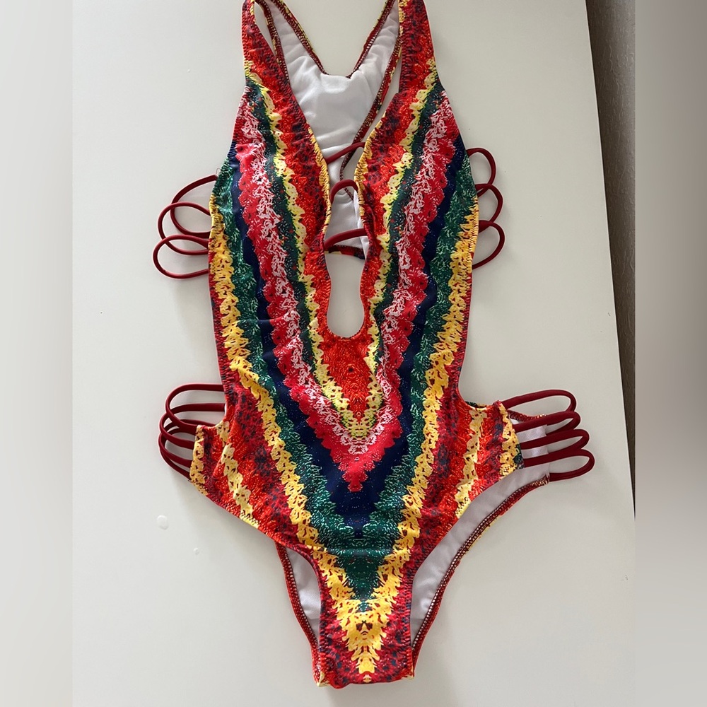 NWOT Never worn, bohemian one pice bathing suit. Size M Gorgeous look!
